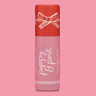 Candy Cane Fluff lip balm in a red and pink holiday tube