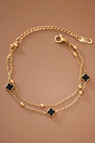 gold chain bracelet with black clover charms