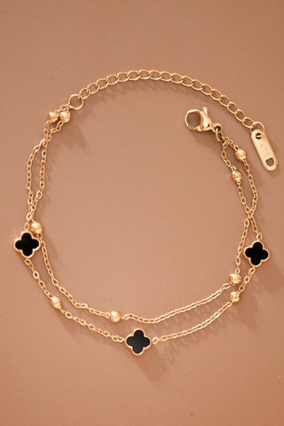 dainty gold chain bracelet with black stones