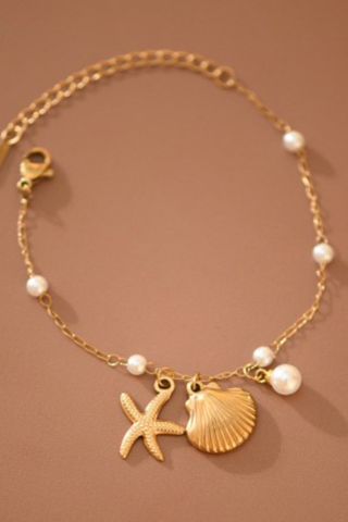 gold seashell bracelet with pearls and starfish
