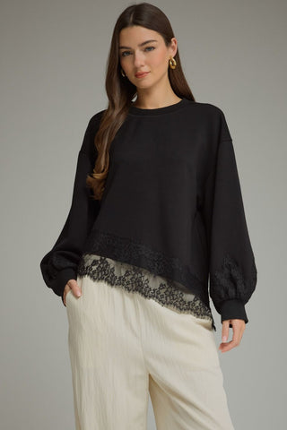 The Emory Long Sleeve Lace Trim Top – black crew neck top with lace hem trim, balloon long sleeves