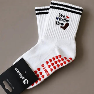 white Yee to the Haw grip socks with red grips