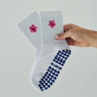 white grip socks with pink hibiscus and navy grips