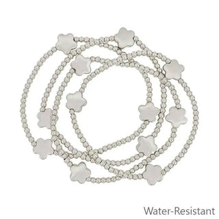 set of 4 silver beaded with flower accent stretch bracelet water resistant