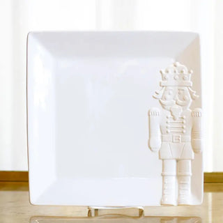 white square platter with embossed nutcracker