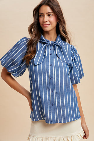 Ellery Strip Denim Bow Top – blue and white stripe button-front top with puff sleeves and a tie neck bow
