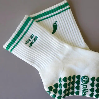 cream grip socks with green stripes and chili pepper