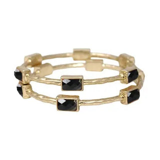 hammered gold bangles with black rectangle epoxy accents