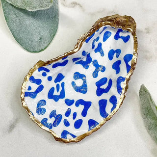 oyster shell trinket dish with blue leopard print and gold edge