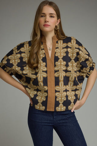 Madeline Grace Printed Short Sleeve V Neck Top – black top with gold ornate floral embroidery, split V neck, tan placket trim, short dolman sleeves