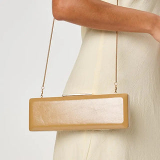 Angie Clutch – structured wine clutch with a gold chain strap