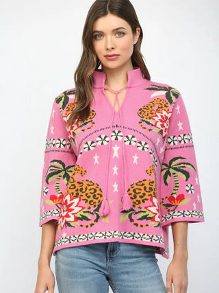 Adelaide Belle Sweater – pink knit sweater with leopard and palm tree tropical motifs and a tasseled split neck