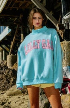 Dilly Dally Reversible Sweatshirt – aqua crew neck sweatshirt with "Dilly Dally" in yellow lettering