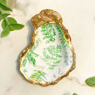 oyster shell trinket dish with green fern leaves and gold edge