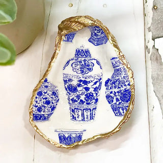 oyster shell trinket dish with blue and white ginger jars and gold edge