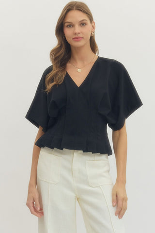 Addison Brooke Top – black V-neck top with short dolman sleeves and a ruffled peplum hem