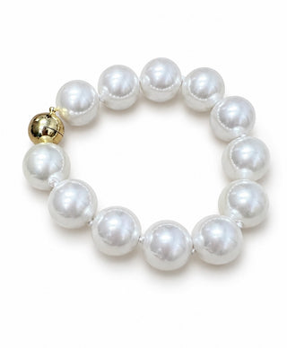 Chunky white faux pearl statement bracelet with gold ball clasp