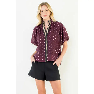 Trudy Burgundy Polka Dot Top – burgundy dot print blouse with embroidered trim placket, mock neck, short sleeves