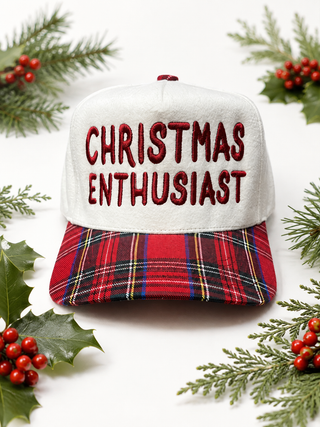 cream Christmas Enthusiast trucker hat with red plaid brim