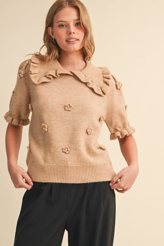 Adley Mocha Mousse Sweater – mocha short sleeve knit sweater with a ruffled collar, ruffle cuffs and 3D flower appliqués