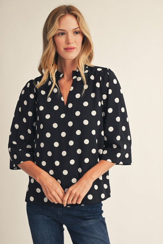 Belle Black Polka Dot Top – black and white polka dot split-neck top with three-quarter puff sleeves