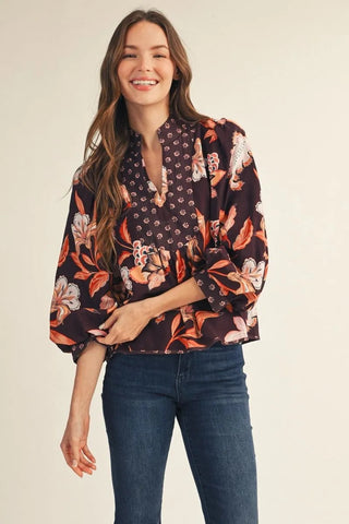 Aspen Paige Puff Sleeve V Neck Floral Top – dark floral print split-neck top with orange blooms and long puff sleeves