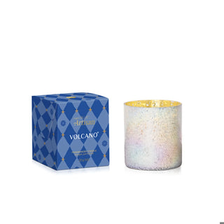 an iridescent tumbler in a blue gift box candle