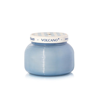 a light blue jar with a silver lid candle