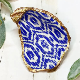 oyster shell trinket dish with blue ikat print and gold edge
