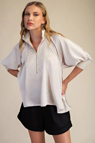 Amelia Faith Top – ivory satin half-zip pullover with a stand collar and wide puff sleeves