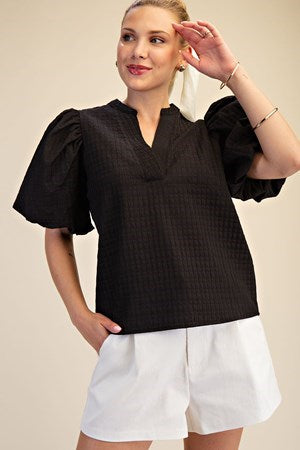 Amelia Rae Top – black textured split-neck top with short puff sleeves