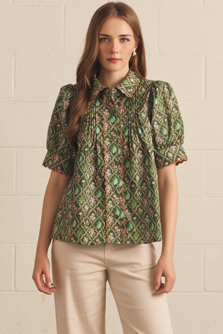 Ainsley Brooke Top – green geometric print collared top with short puff sleeves and a pleated front