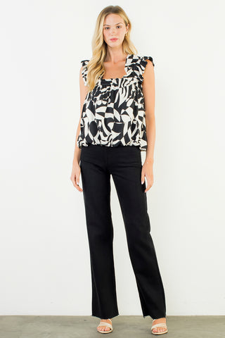 The Geometric Print Top – black and white abstract floral print top, ruffle cap sleeves